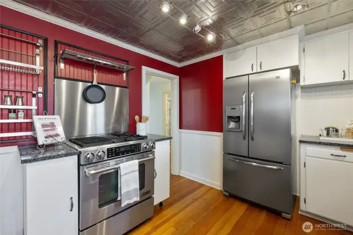 Jenn-air downdraft range and stainless fridge.