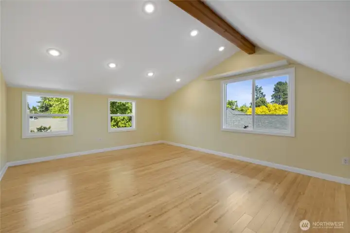 Vaulted ceilings and a view of the backyard