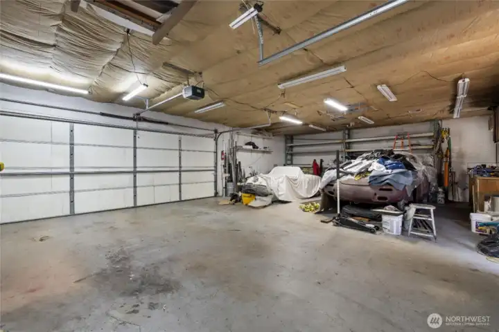 Interior of garage/shop. Huge door to the alley.  Fully insulated and heated. Park up to 4 cars!