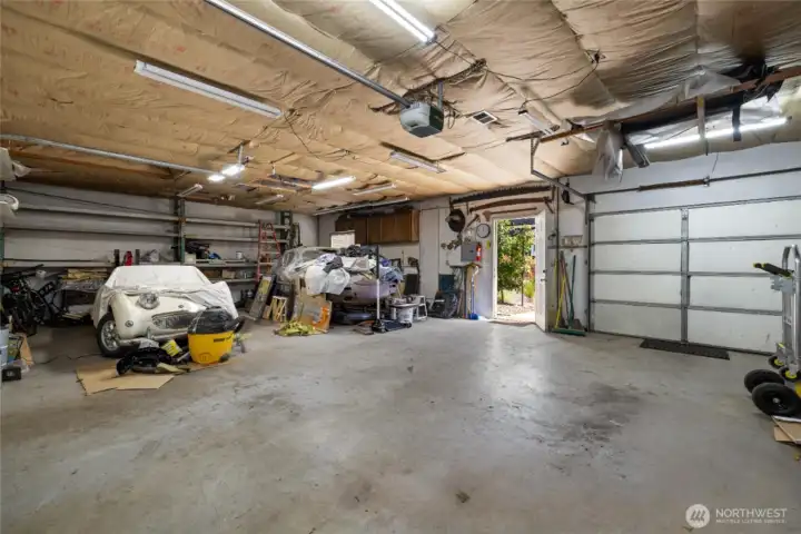 Garage also has a person door and a roll-up door to the backyard.  All items will be removed prior to closing.
