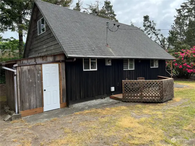 Storage shed behind the house and a better look at the second deck.