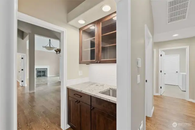 Combination wetbar & butler's pantry with new cabinets and counters.