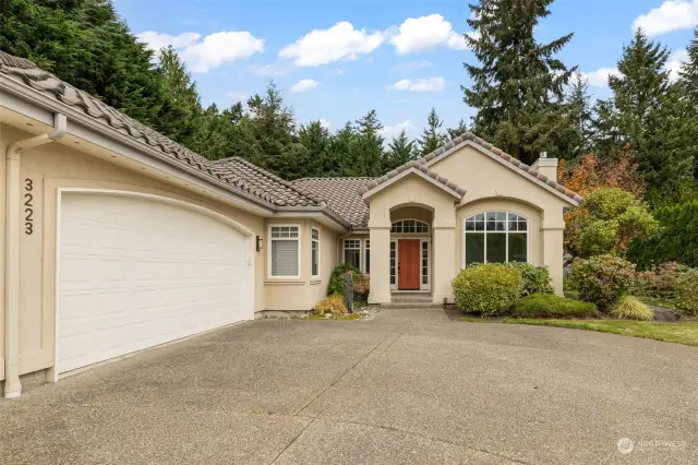 3-car garage and large driveway approach