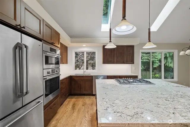 Downdraft cooktop on new island. Skylights have been added to this room.