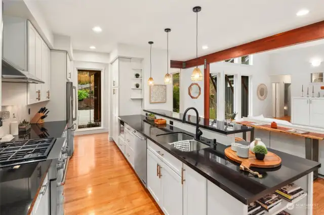 Slab Counters and Steel Appliances, w/ LED Lighting creates a Chef's Kitchen~