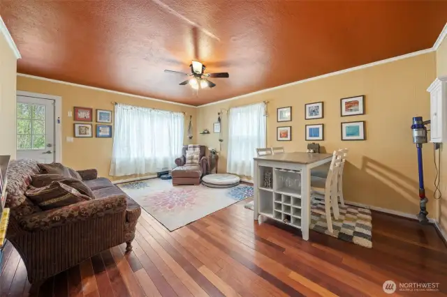 Flowing floor plan & beautiful hardwood floors in the living room, & a large picture window overlooking the front yard providing an abundance of natural light.