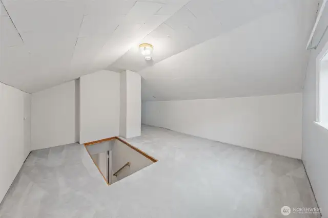 Upstairs room with carpet.