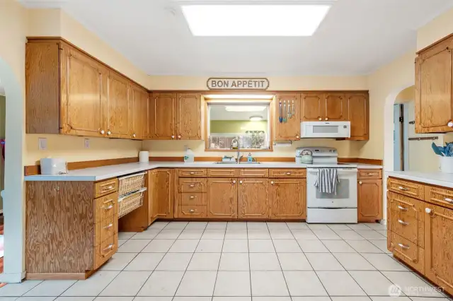 Spacious kitchen with lots of cabinets.