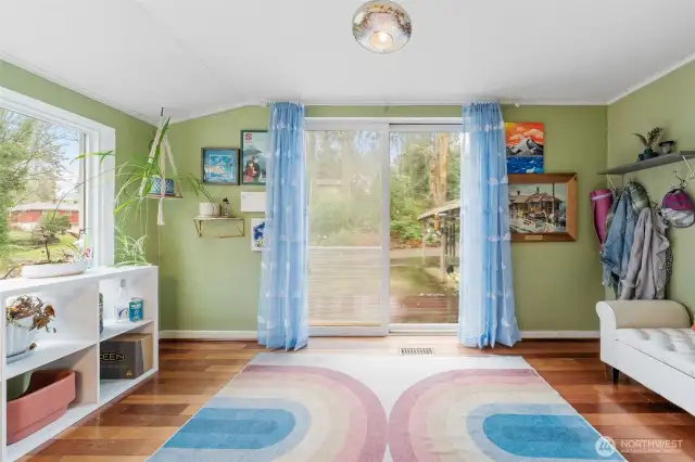 Dining room with sliding glass door out to the deck. So many possibilities for this room. Yoga room, Sunroom etc...
