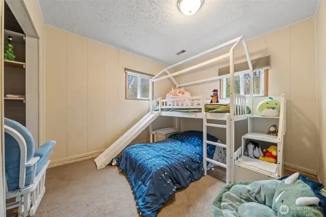 Carpeted bedroom.