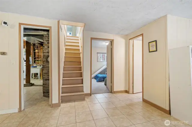 Up these stairs you will find a very spacious bedroom.