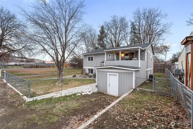 Front exterior with exterior shed