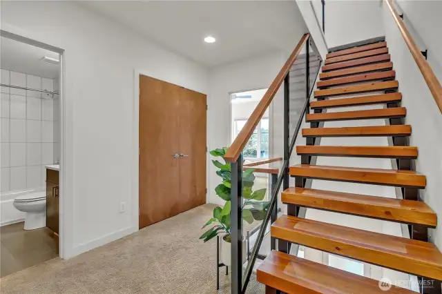 Beautiful stairs to the 3rd floor primary suite.