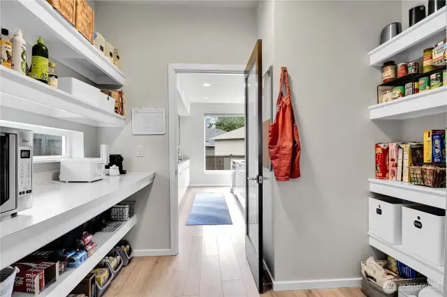 The walk-in butler’s pantry adjacent to the kitchen is something that isn’t commonly added to homes these days, but it should be.  Convenient yet concealed, with tons of additional shelf space.  This butler’s pantry provides a place to keep those multi-packs from Costco and just about anything else big and bulky you need to store for your kitchen and entertaining needs.