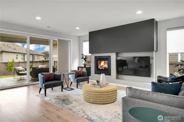 A cozy gas fireplace highlights the family room and adds ambiance to this spacious and comfortable great room.