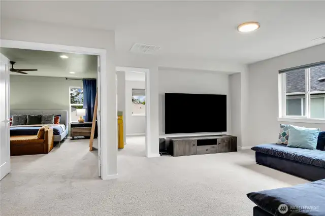 This room at the top of the stairs is perfect for watching movies, playing games or hanging out. Or it can be used as a second home office or hobby area.