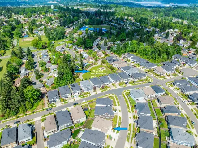 Excellent location and only a few minute walk to the big Allura neighborhood park with wide gravel walking paths, spacious flat grassy areas and picnic tables.  High-quality play structure with three slides, a climbing wall and multiple climbing and play stations.