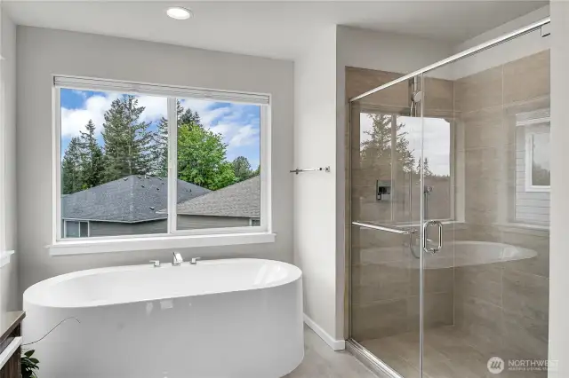 The oval soaking tub and oversized glass enclosed shower make you feel like you’re at a luxury spa.