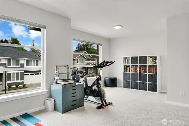 Bedroom four could be used as a bonus room because of its size and location.  This spacious room has a walk-in closet.  A small window overlooks the side yard and two oversized picture windows overlook the front yard.
