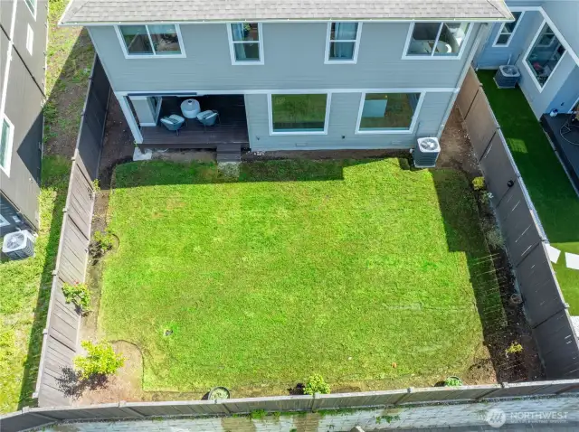 Fully fenced backyard with pedestrian gate.