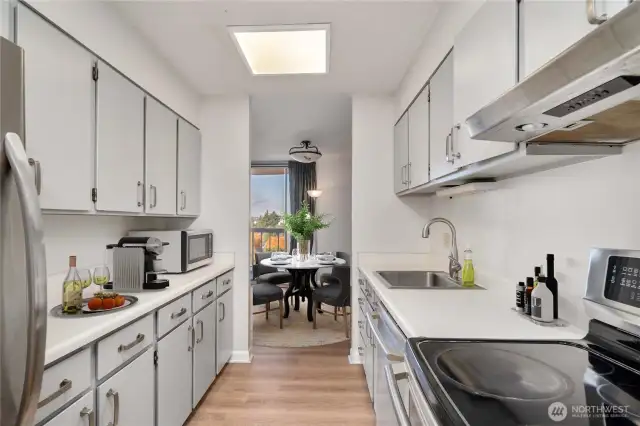 Kitchen has been updated with newer appliances, fresh painted cabinets and hardware.