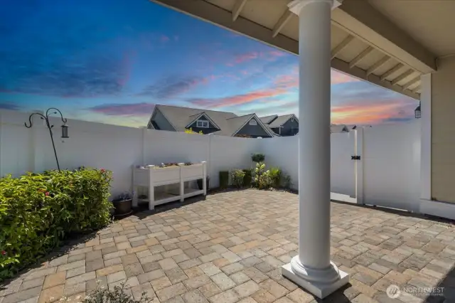 Experience privacy and charm in this fully landscaped, fenced patio area—ideal for outdoor living and entertaining
