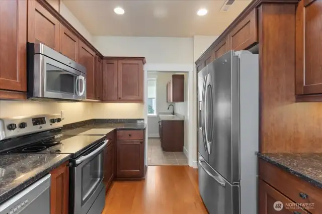 This stunning kitchen features stainless steel appliances—all included with the home—paired with stylish finishes and ample counter space, perfect for everyday living and entertaining.