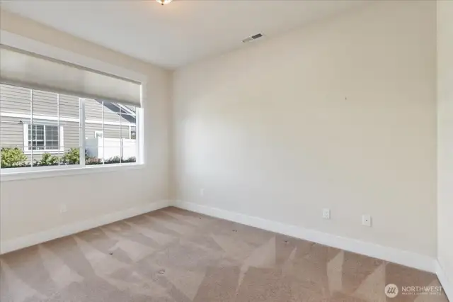 Perfect for guests, a home office, or creative space, this bright third bedroom adapts to your lifestyle needs.