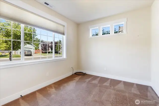 Bright and roomy, this spacious second bedroom offers versatile space for guests, an office, or personal retreat.