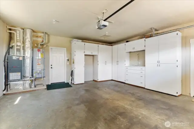 Keep your vehicles and belongings organized with ample space and custom built-in cabinets for added convenience
