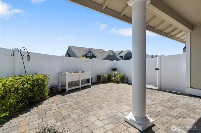Experience privacy and charm in this fully landscaped, fenced patio area—ideal for outdoor living and entertaining.