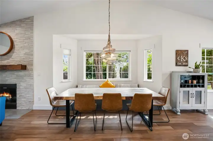 Large dining area with built in storage bench seating under window
