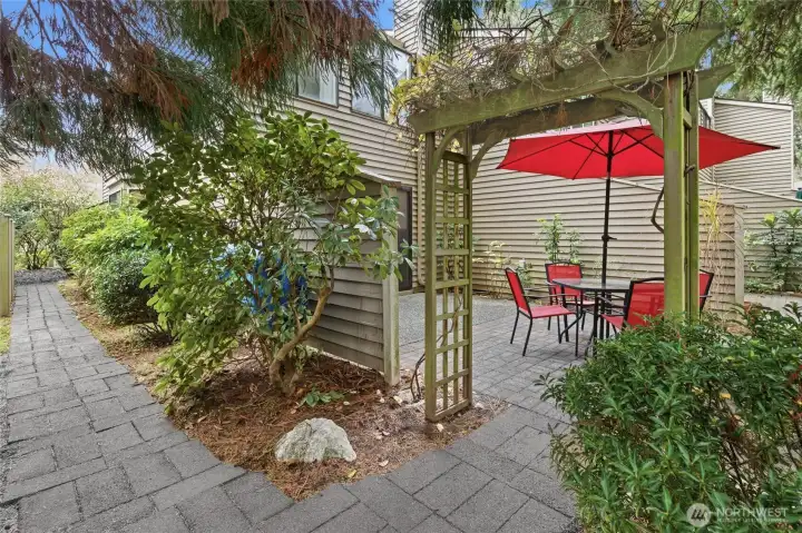 side brick walkway to back patio and gardening area