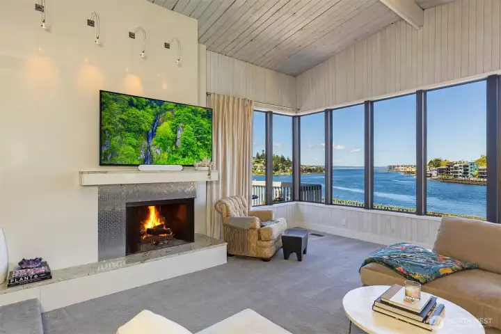Wall of windows to views. Cozy fireplace.