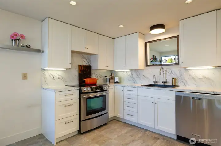 Lower level dine in kitchen is updated and has stainless appliances.