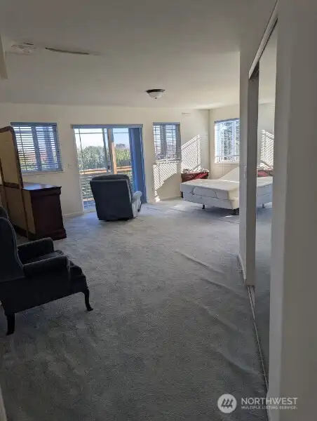 One of two primary suites on the 2nd floor. This one has mountain & ocean views, wood burning fireplace, full bath and walk-in closet. Has water intrustion in ceiling.