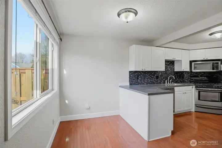 Dining area with easy access to kitchen for cooking and entertaining.