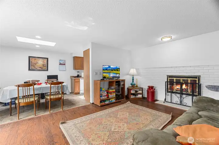 This is unit 1074. Spacious and clean, with laminate floors in the living room and bedrooms. Nice light with a skylight above the dining area.