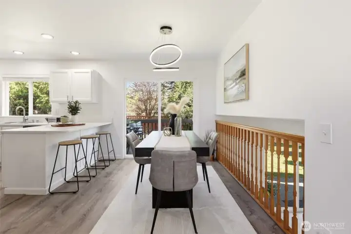 Dining room with access to the backyard and updated eat-in kitchen.