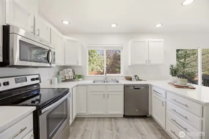 Prep meals in your updated eat-in kitchen complete with quartz countertops and stainless steel appliances.