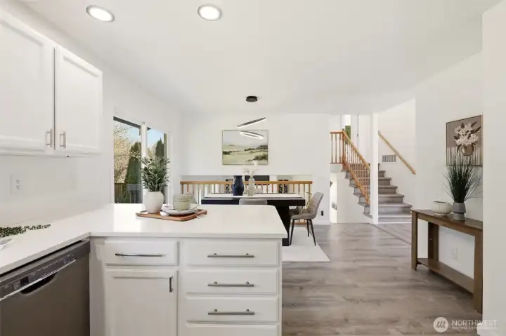 The upper stairs lead to the bedrooms and lower stairs take you to the family room.