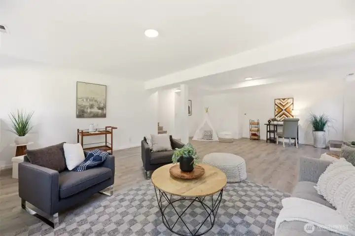 Lower flex space offers  many possibilities. Ideal for home office, guest area, workout room, media space, or playroom.