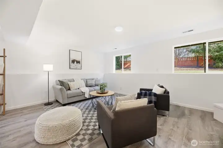 Lower flex space offers  many possibilities. Ideal for home office, guest area, workout room, media space, or playroom.