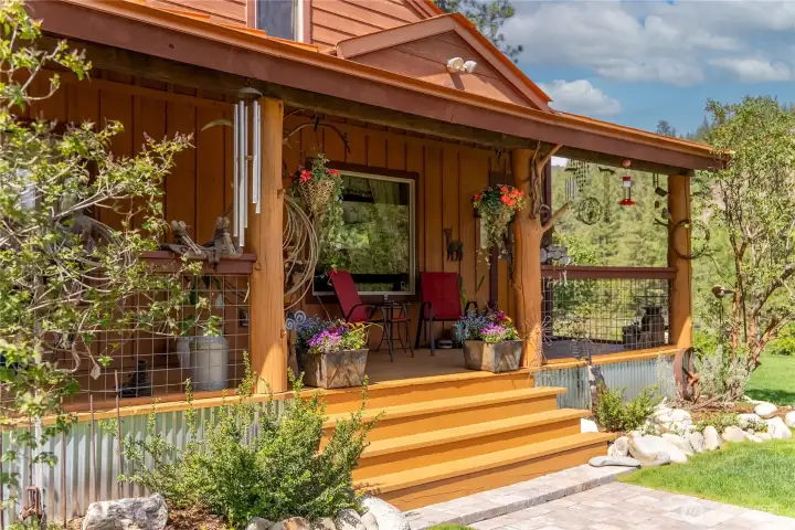 Covered porch and entry to sit and watch the world go by.