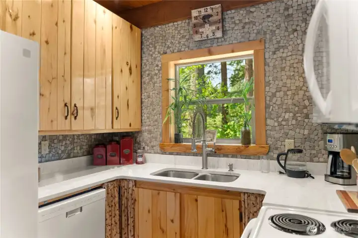 A well designed kitchen includes all of the appliances, including a dishwasher!