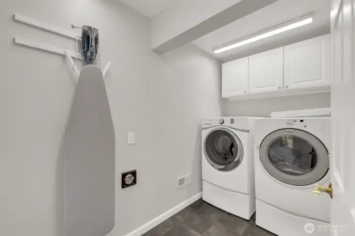 Utility room is located off the rec room on first floor.