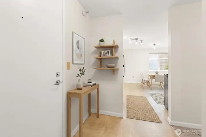 Another view of the virtually staged entrance opening to the large virtually staged kitchen.