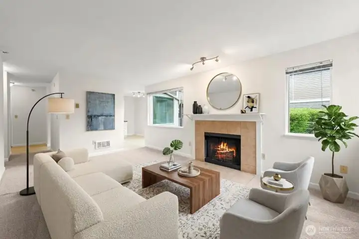 Well-appointed virtually staged living room with the wood burnng fireplace.