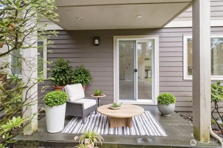 Trex deck off the living room is virtually staged.