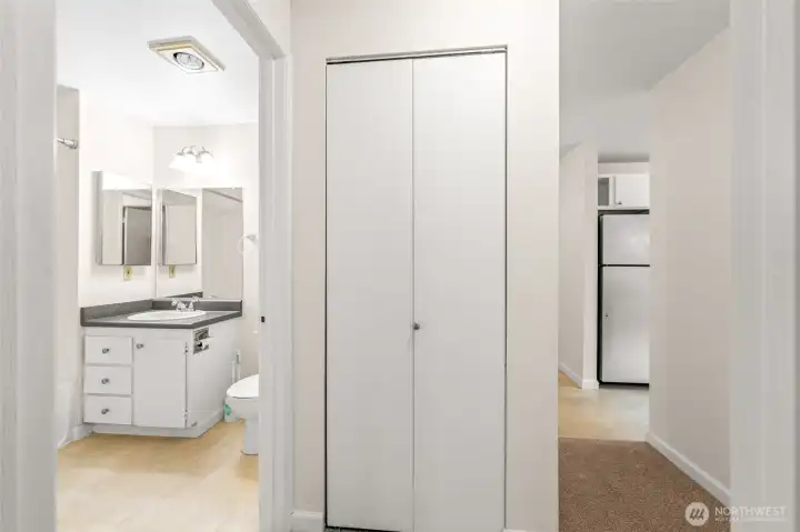 There is a newer stackable washer and dryer in this closet.